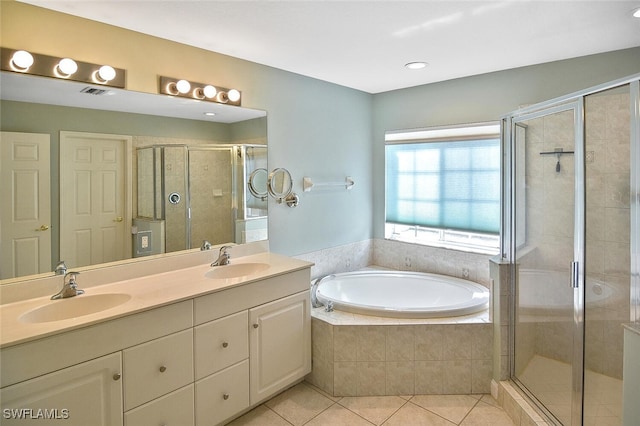 bathroom featuring tile patterned flooring, shower with separate bathtub, and double sink vanity