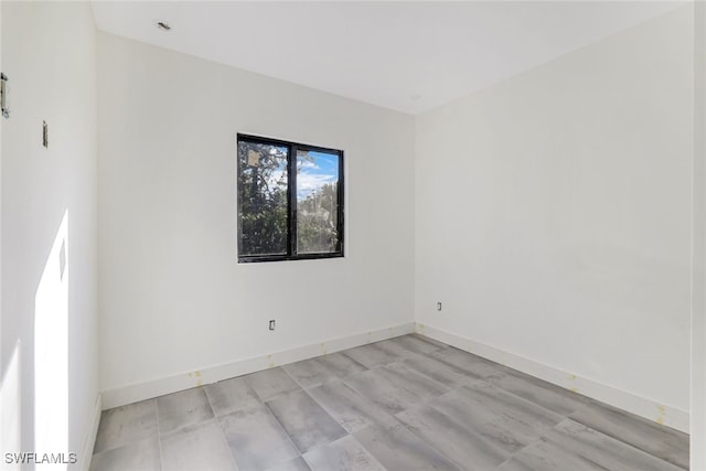 unfurnished room featuring light wood-type flooring