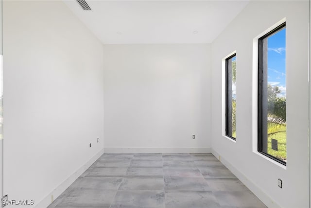 spare room with a wealth of natural light