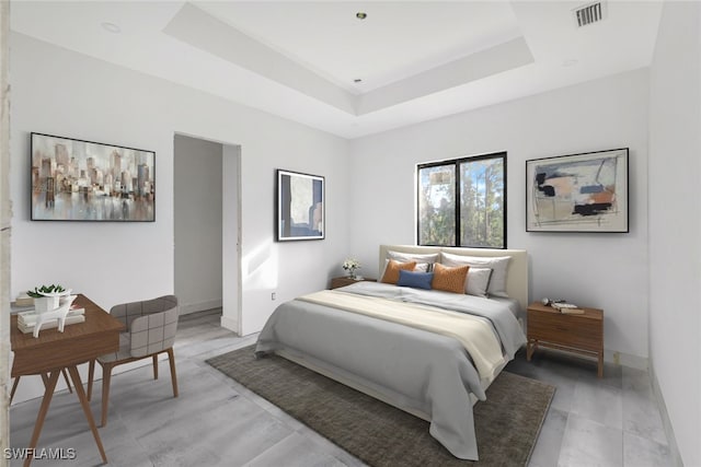 bedroom featuring a raised ceiling