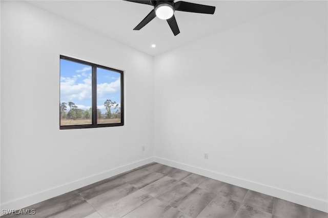 spare room featuring ceiling fan, recessed lighting, and baseboards