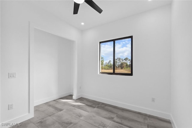 empty room with ceiling fan, recessed lighting, and baseboards