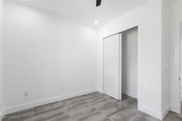 unfurnished bedroom with ceiling fan, baseboards, a closet, and recessed lighting