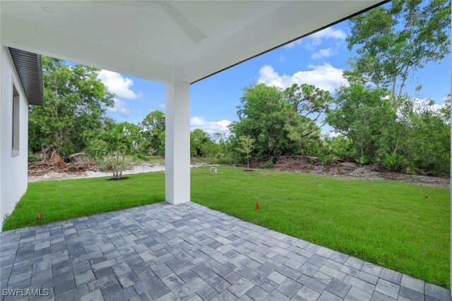 rear view of house with stucco siding, roof with shingles, a lawn, and central air condition unit