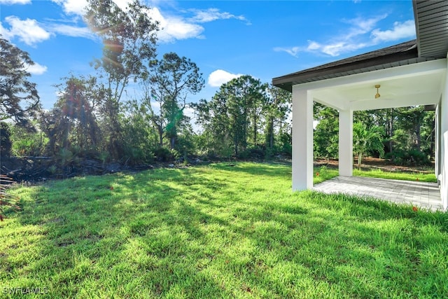 view of yard featuring ceiling fan