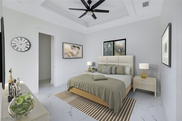 bedroom with marble finish floor, visible vents, and a raised ceiling