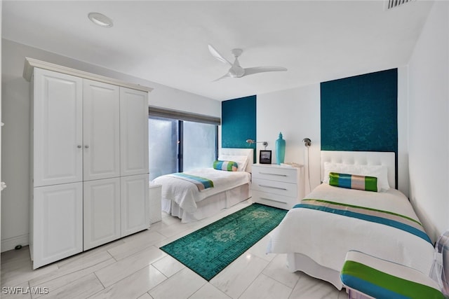 bedroom featuring ceiling fan and a closet