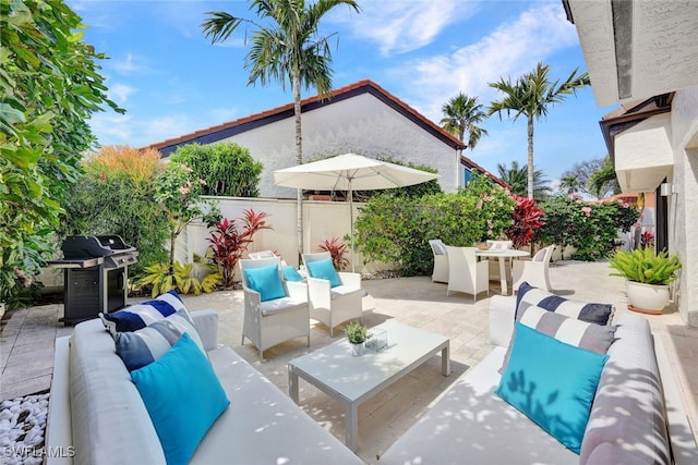 view of patio featuring an outdoor hangout area and grilling area