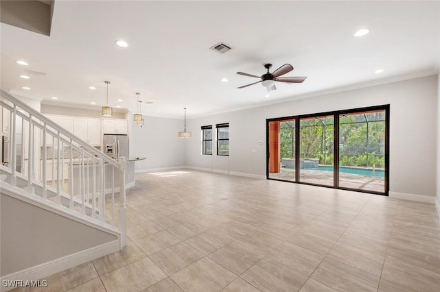 tiled spare room with ceiling fan and ornamental molding