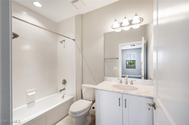 full bathroom featuring toilet, tiled shower / bath combo, and vanity