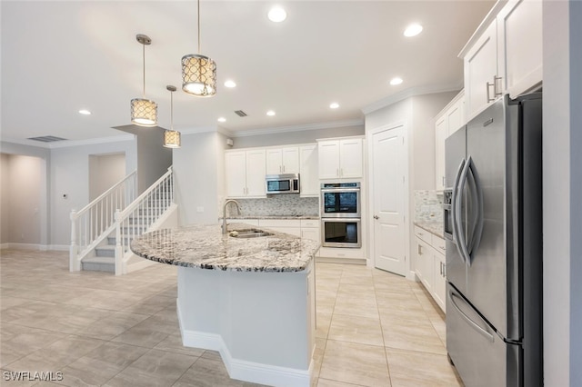 kitchen featuring stainless steel appliances, decorative backsplash, ornamental molding, sink, and light stone countertops