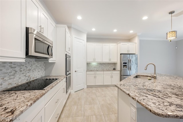 kitchen featuring backsplash, stainless steel appliances, white cabinetry, and sink