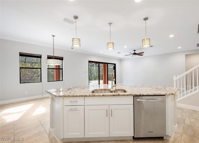 kitchen with a wealth of natural light, white cabinets, stainless steel dishwasher, and sink