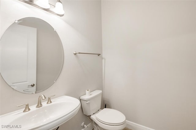 bathroom with sink and toilet