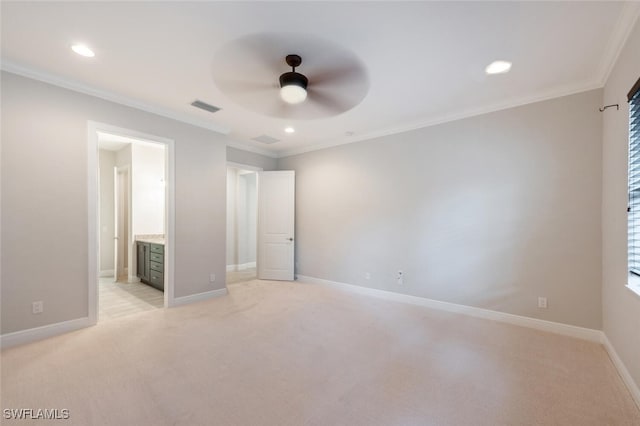 unfurnished bedroom with ceiling fan, crown molding, light carpet, and ensuite bathroom