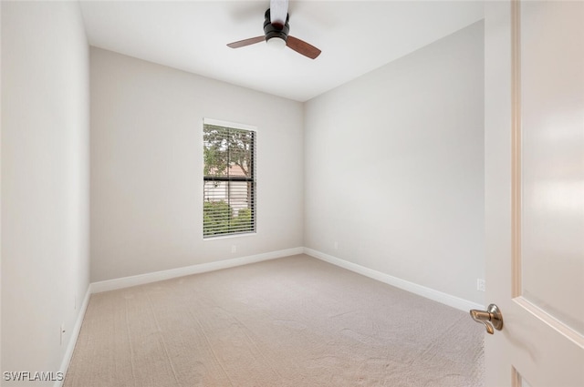 spare room featuring ceiling fan and carpet flooring