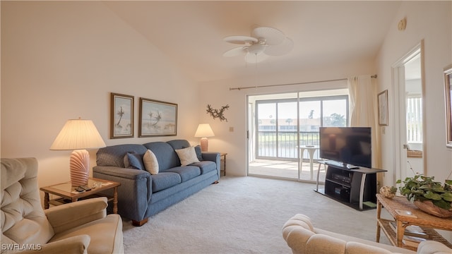 carpeted living room with high vaulted ceiling and ceiling fan