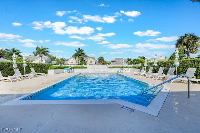 view of swimming pool with a patio area