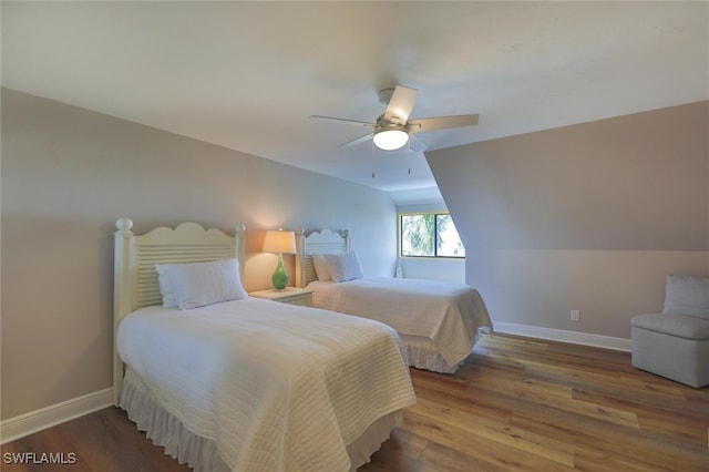 bedroom featuring hardwood / wood-style flooring, vaulted ceiling, and ceiling fan