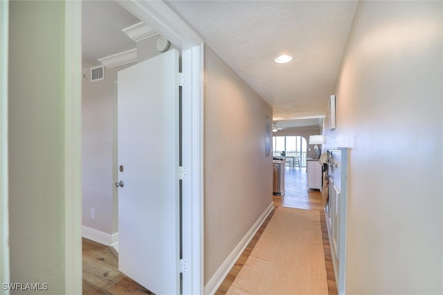 hallway with light wood-type flooring