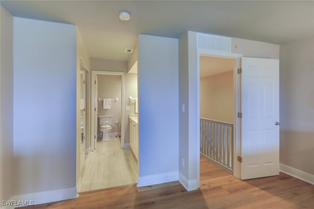 hallway with light wood-type flooring