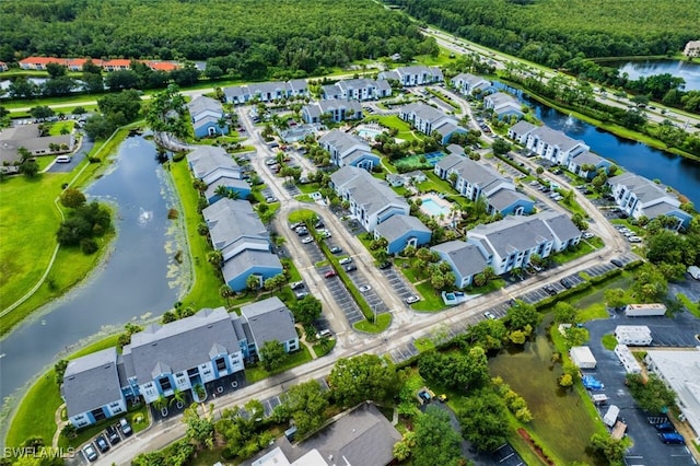 bird's eye view with a water view and a residential view