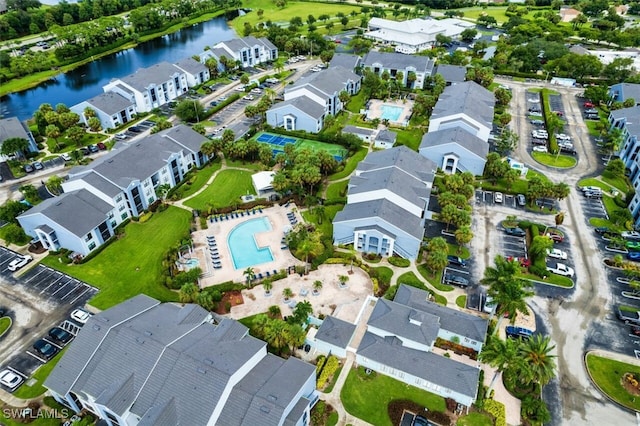 birds eye view of property featuring a residential view and a water view