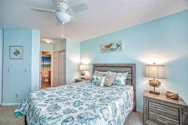 carpeted bedroom with ceiling fan, a closet, a textured ceiling, and connected bathroom