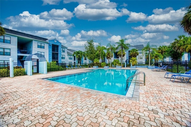 view of swimming pool with a patio area