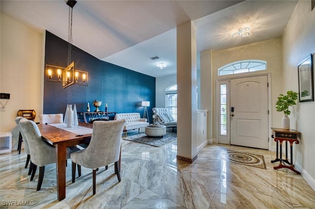 dining area featuring a chandelier