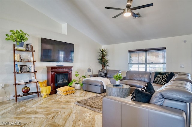 living room featuring ceiling fan and lofted ceiling