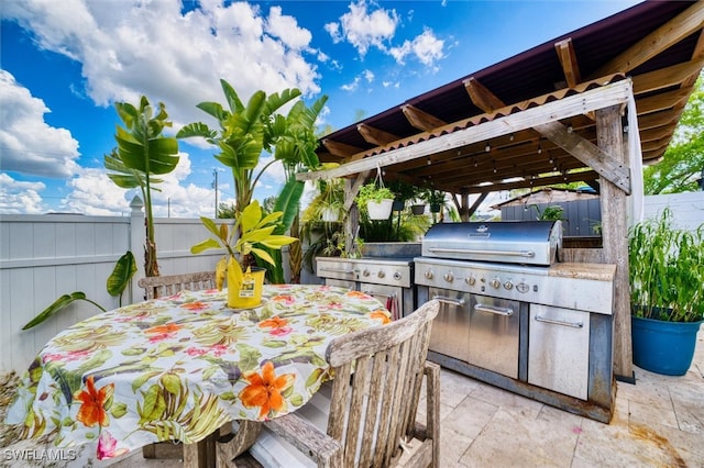 view of patio / terrace featuring an outdoor kitchen and grilling area