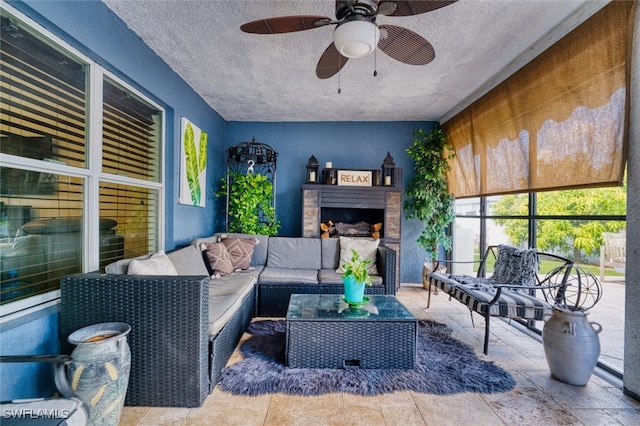 interior space with ceiling fan