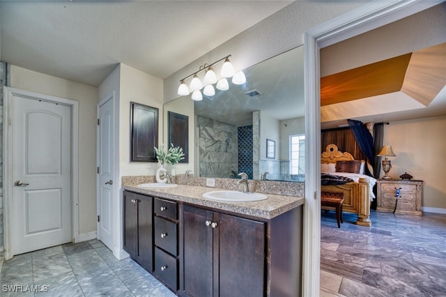 bathroom with walk in shower and vanity