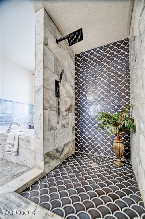 bathroom featuring a textured ceiling and walk in shower