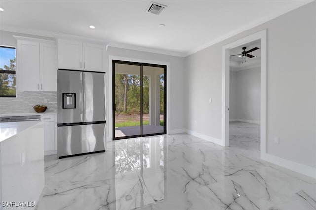 kitchen with decorative backsplash, stainless steel fridge with ice dispenser, light tile patterned floors, white cabinets, and ceiling fan