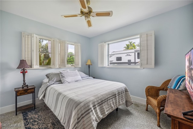 bedroom featuring ceiling fan and baseboards