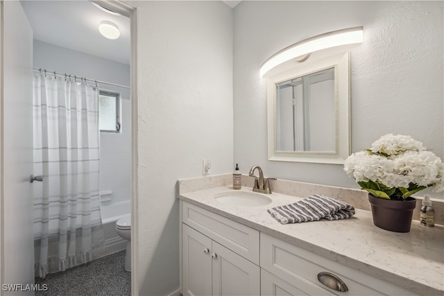 full bath with toilet, a textured wall, shower / tub combo with curtain, and vanity