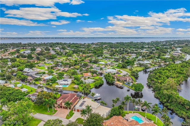 birds eye view of property featuring a water view and a residential view