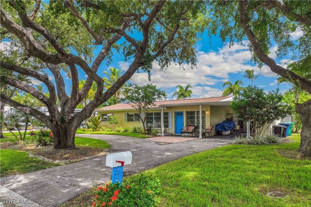 single story home with a front yard