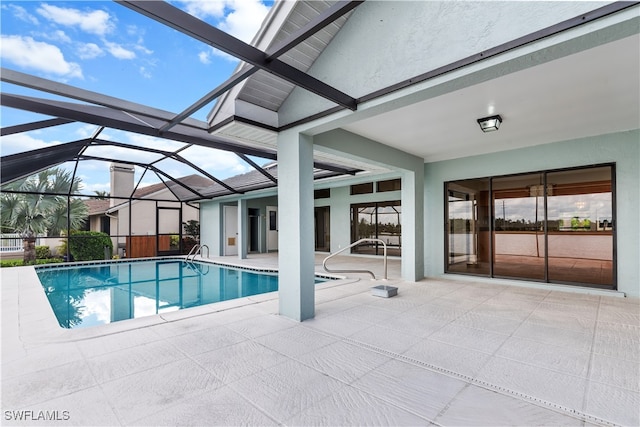 view of pool featuring a lanai and a patio area