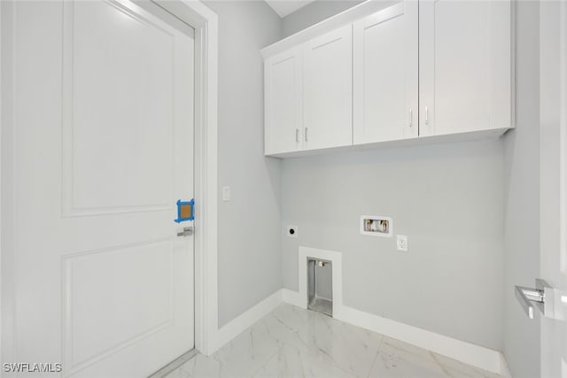 2802 63rd St W, Lehigh Acres, FL 33971 - washroom featuring electric dryer hookup, hookup for a washing machine, light marble finish flooring, baseboards, and cabinet space