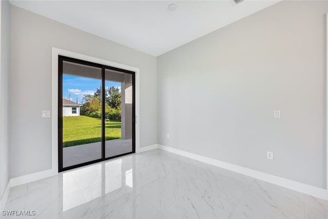 2802 63rd St W, Lehigh Acres, FL 33971 - empty room with light marble finish flooring and baseboards