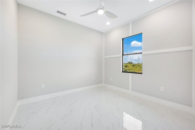 2802 63rd St W, Lehigh Acres, FL 33971 - spare room with ceiling fan, recessed lighting, marble look tiles, and baseboards