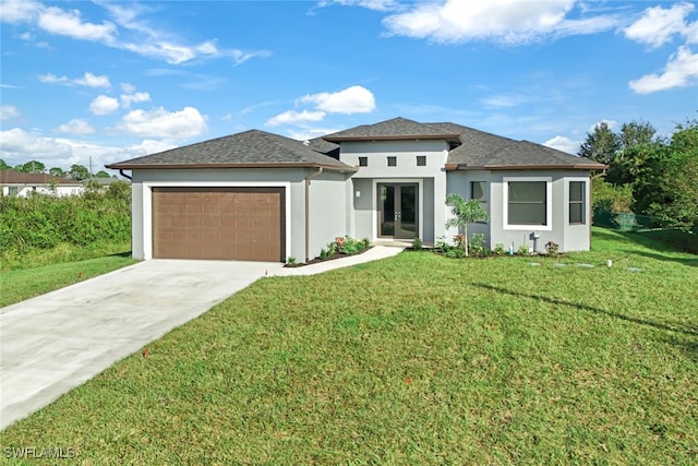 prairie-style home with a front lawn and a garage