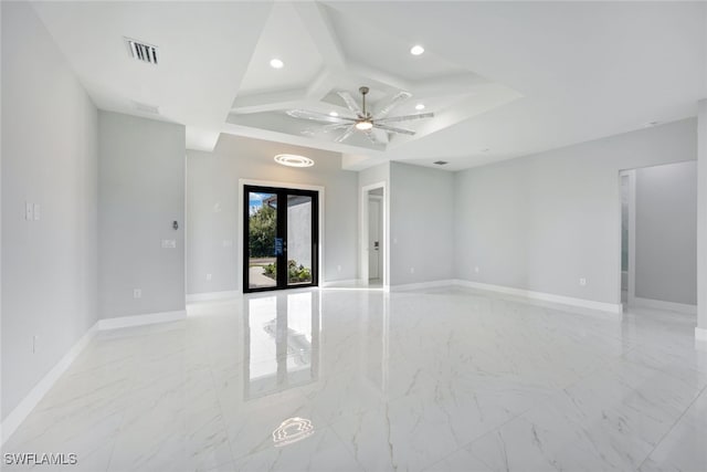 empty room featuring french doors, beamed ceiling, and ceiling fan