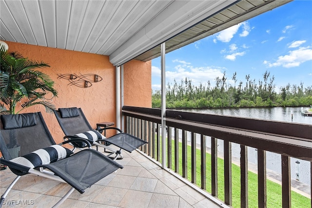 balcony featuring a water view