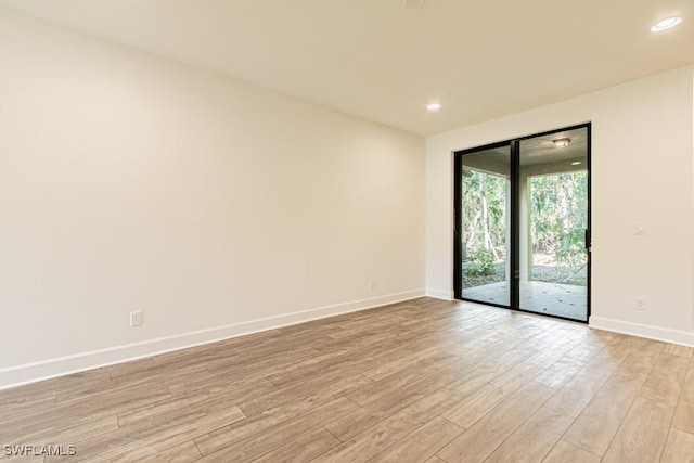 empty room with light hardwood / wood-style floors