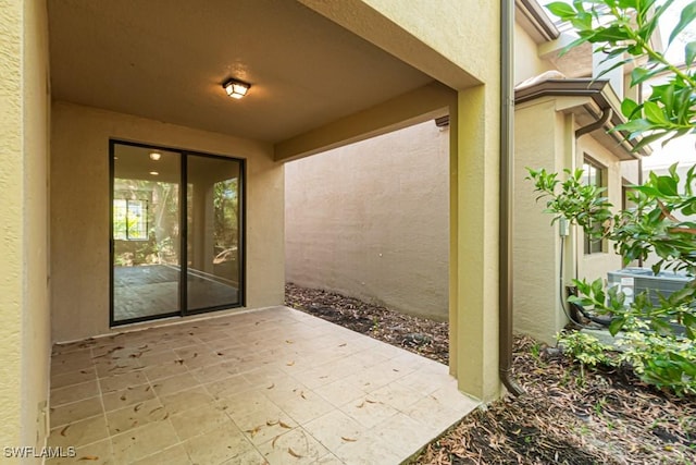 property entrance featuring a patio area