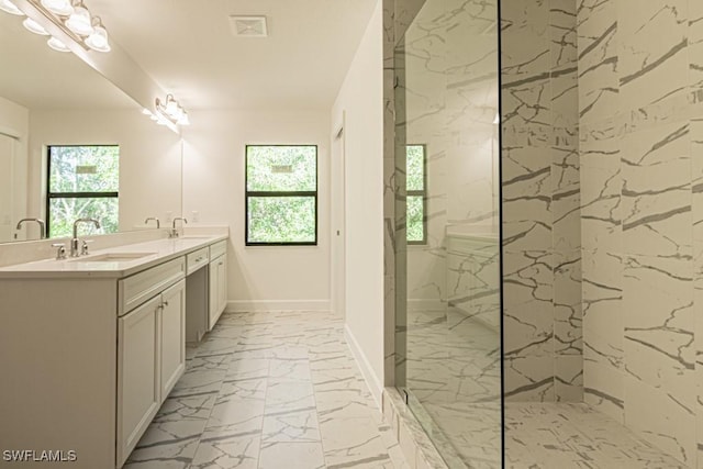 bathroom featuring vanity and tiled shower